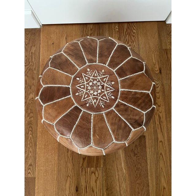 Chocolate brown Moroccan pouf ottoman, perfect addition to any bedroom, office, dorm room. Dthe leather is smooth and the...