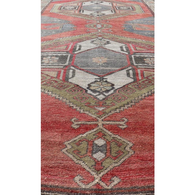 Red field vintage Turkish Oushak rug with vertical geometric medallions, Keivan Woven Arts / rug TU-MTU-8 , country of...