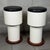 A pair of modernist bar stools attributed to Italian craftsmanship of the 1960s, characterized by an iconic Space Age...