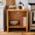 This late 20th-century American pedestal cabinet is defined by its architectural silhouette and honest materiality....