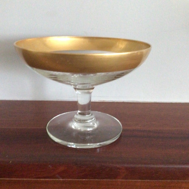Here is a vintage Dorothy Thorpe pedestal candy dish with 1 inch gold band around the rim.