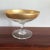 Here is a vintage Dorothy Thorpe pedestal candy dish with 1 inch gold band around the rim.