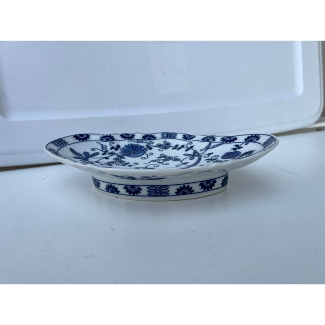 Vintage blue onion pattern footed diamond shaped bowl. Fine porcelain cobalt blue and with Vienna Woods design . Made in...