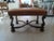 A fabulous Ebanista Style Leather bench in the Italian baroque style. Nicely Carved and with a double nailhead trim. This...