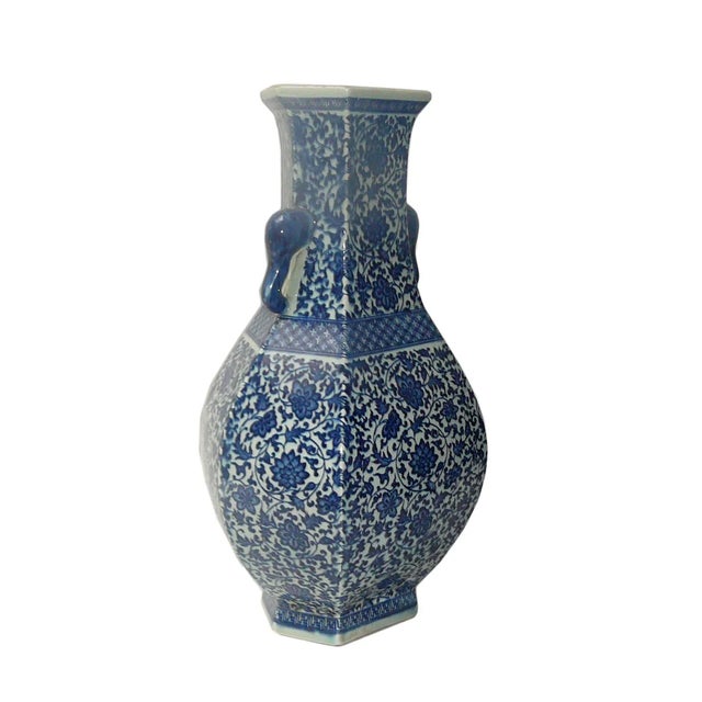 This is a traditional Chinese decoration vase in blue & white color with detail combination of oriental lotus flower...