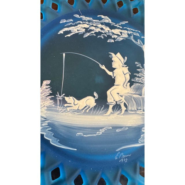 This blue satin mist plate with a forget-me-not border is in the Mary Gregory style that was produced by Westmoreland...
