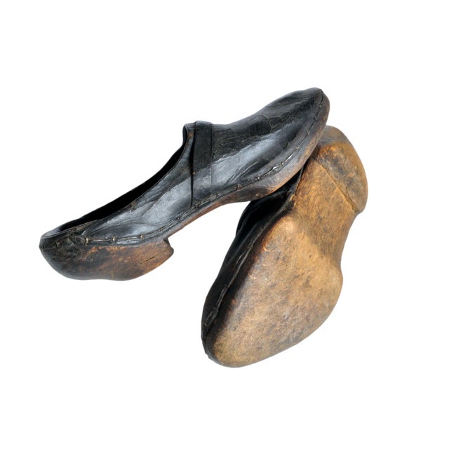Offered is a pair of black antique wooden shoes. They don't make them like they used to! Perfect to add to your collection...
