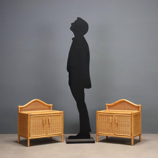 Pair of 1980s woven wicker nightstands, featuring a solid beech wood structure and poplar veneer details. Each nightstand...