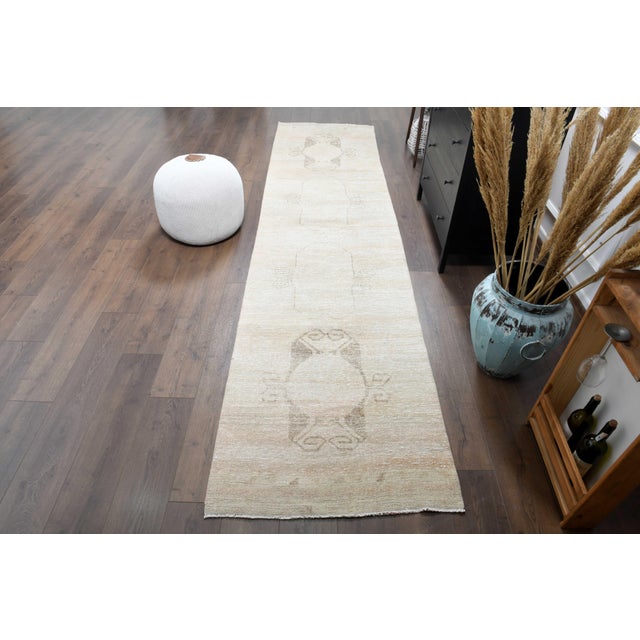 Vintage Turkish Hand-Knotted Runner rug is a semi-antique vintage runner rug. The '70s Eastern region of Anatolian's...
