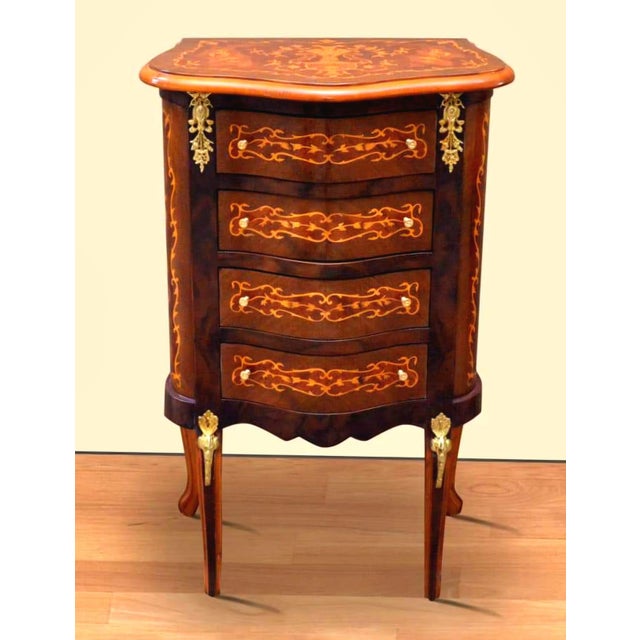 Bring timeless French elegance into your home with this petite Louis XV-style commode, beautifully crafted from wood and...