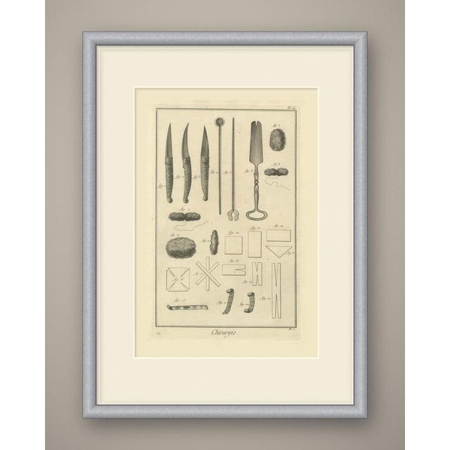 An original antique copper engraving, uncolored, showing instruments and dressings in twenty three numbered figures. At...