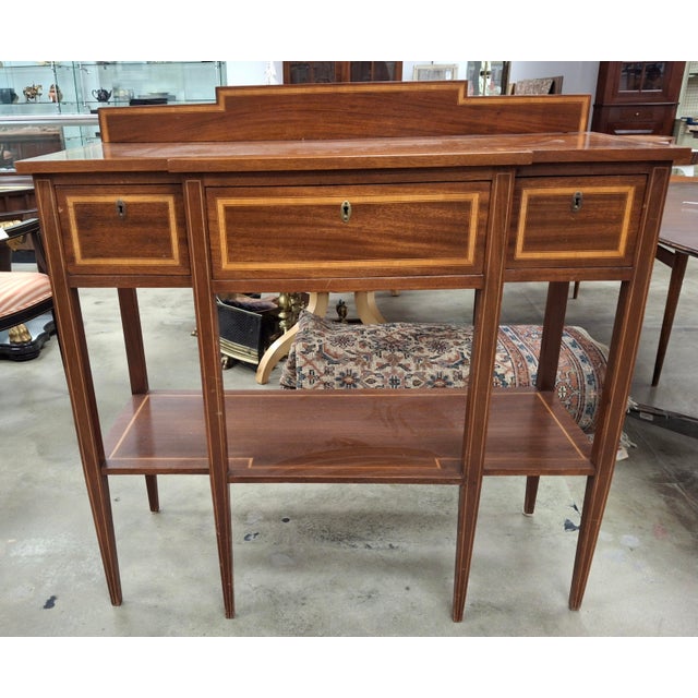 An exceptional George III Style Satinwood Inlaid Mahogany tiered Serving Table. Measures 42" in width , 17.5" on depth,...