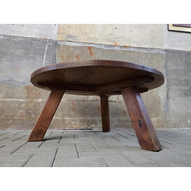 This large and heavy round table is made during the 1970s of solid European oak. The design is simple and elegant, with a...