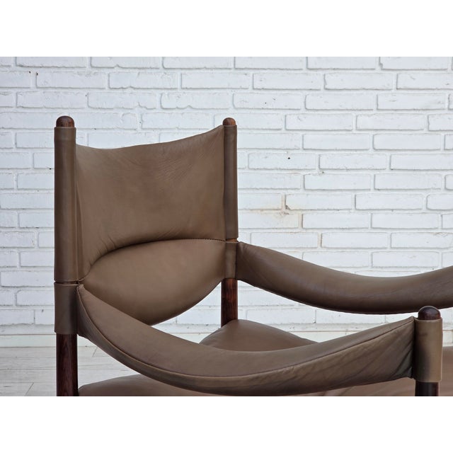1970s, Danish design by Kristian Vedel. Highback armchair model "Modus". Original brown furniture leather and teak wood....