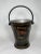 Early twentieth century ships deck bucket with heavy carry and bale handles. Painted black with later decoration that...