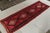 Handwoven in wool circa 1920-1930, this 4x12 antique Persian Kilim exemplifies the richest colors and most classic tribal...