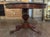 Handsome 19th century French Charles X Mahogany center table with carvings and a beautiful gray marble top. An elegant...