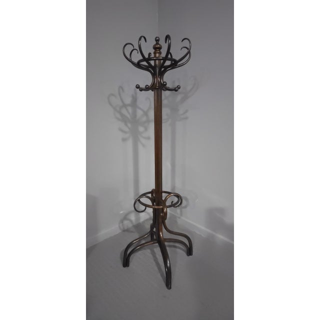 A very good quality Victorian swivel top bentwood coat and stick stand, in overall excellent condition. 79" high 18"...