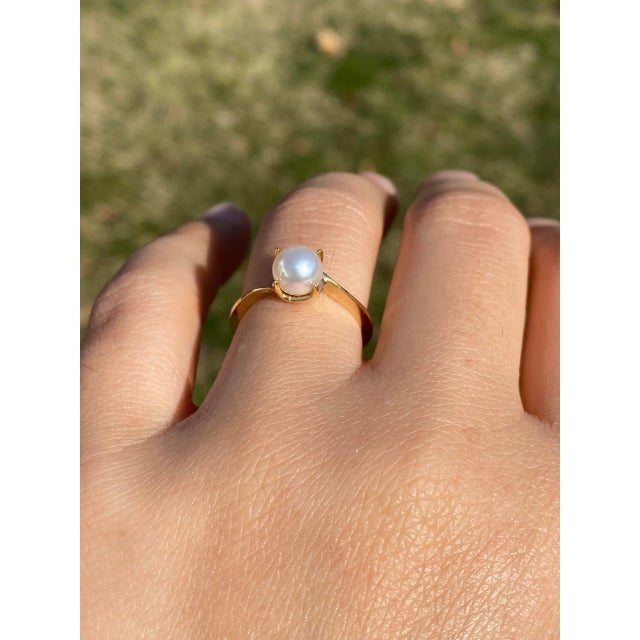 The Leduc: Solitaire Pearl Ring with Bypass Shank in Yellow Gold. This elegant ring features a lustrous 6.5mm Akoya pearl...