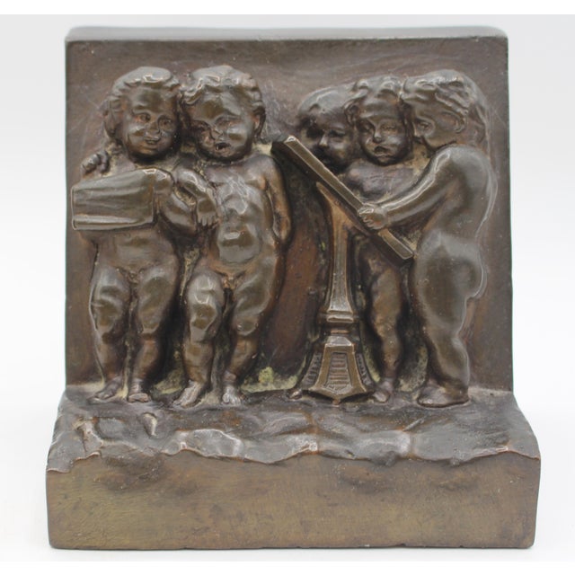 Circa 1900 Pair of Bronze Plated Bookends Featuring Reliefs of Putti For Sale - Image 4 of 8