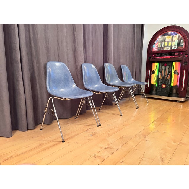 Set of four DSS fiberglass chairs, designed by Charles and Ray Eames for Herman Miller, 1970s. In original and good...