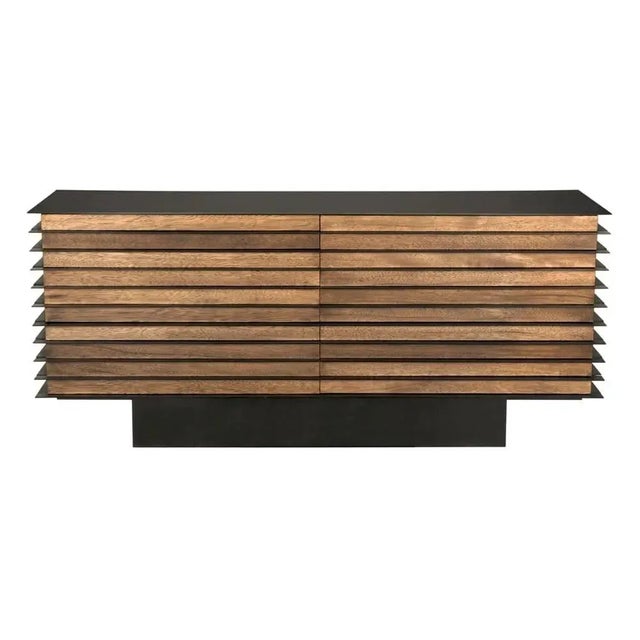 Crafted from rich walnut wood and industrial-grade steel, the Elevation Sideboard marries natural warmth with urban...