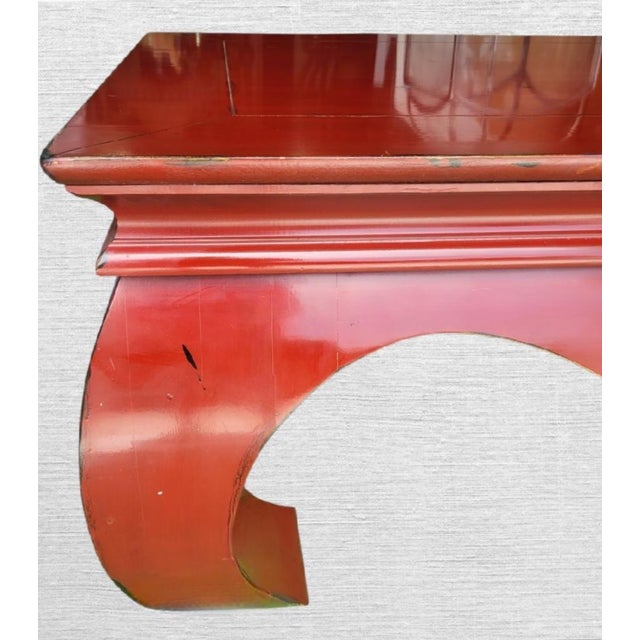 Make a bold statement with this striking Ming-style coffee table finished in a vivid vermilion red lacquer. Featuring...