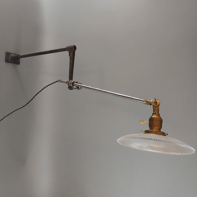 A beautifully articulated early 20th‑century O.C. White industrial lamp, featuring the company’s iconic cast‑iron joints,...