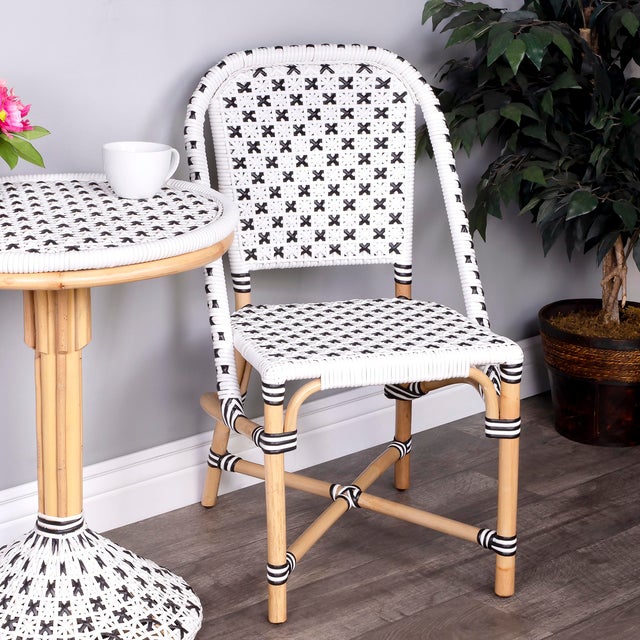 This sophisticated, stylish side chair will infuse island charm in any dining room, kitchen, or office. The chair features...