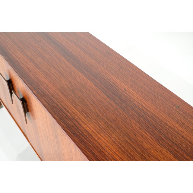 "Inger 250" model sideboard in wood with three doors and 8 drawers with a beautiful flamed finish and the same finish on...