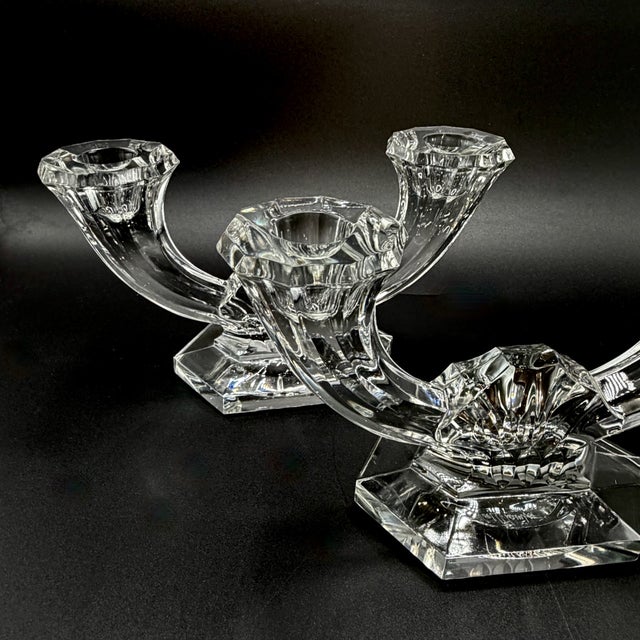 A pair of vintage twin-arm crystal candelabra by Val Saint Lambert, both engraved to the base. Designed in the elegant...