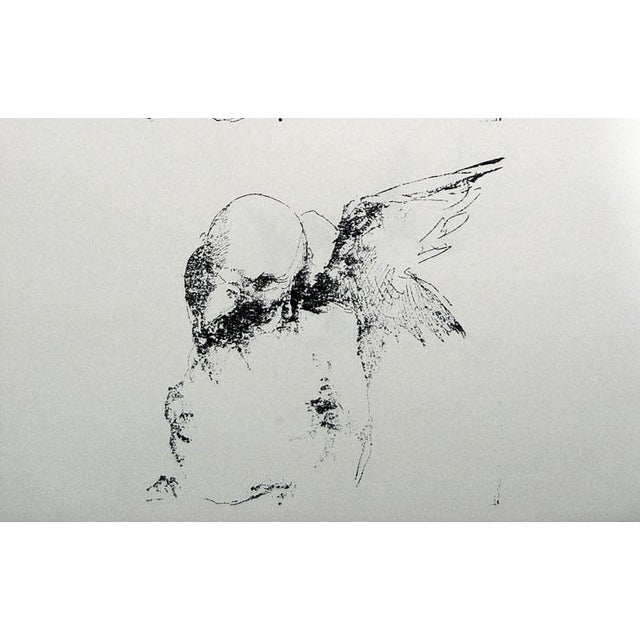 Vintage relief printing block of etched metal mounted on wood block. Man with bird head and wings. Very much in the manner...