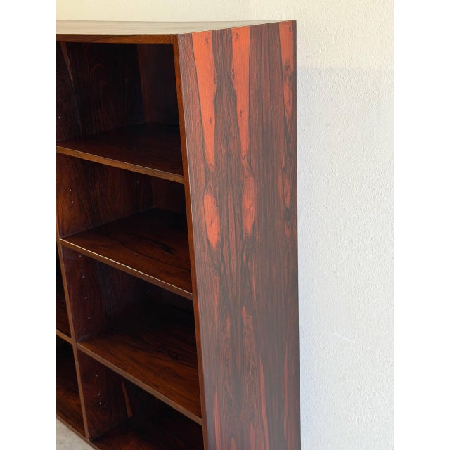 Beautiful vintage Danish Mid Century Modern bookcase crafted in richly grained rosewood. The dramatic rosewood showcases...
