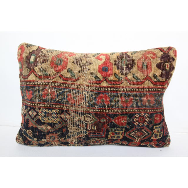 This one of a kind pillow cover is crafted from a genuine antique tribal rug, showcasing centuries old weaving traditions....