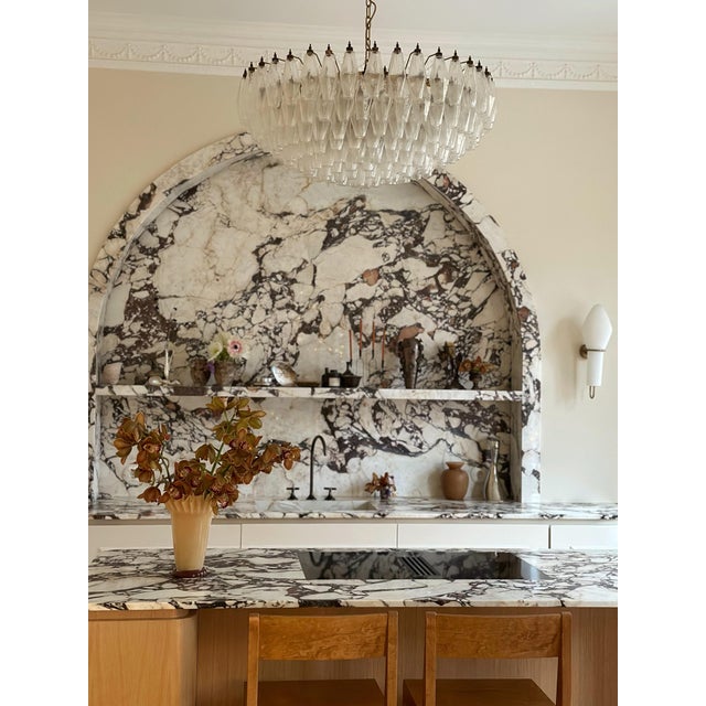 Pair of huge elegant murano chandeliers in the style of carlo scarpa with beautiful hand blown poliedri prisms. lamp...