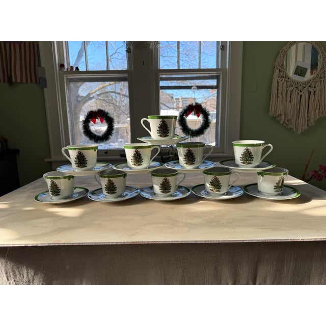 A charming and collectible set of 10 vintage Christmas teacups and saucers from the beloved Yule Tide pattern by Georges...