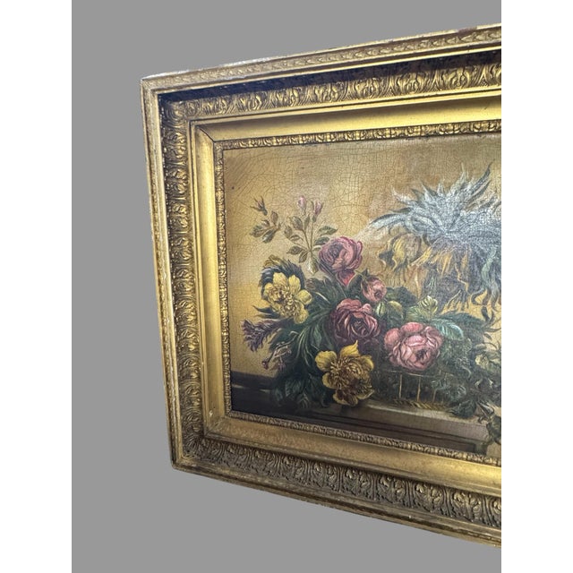 Beautiful antique oil on canvas floral still life painting, depicting an abundant arrangement of roses and assorted...