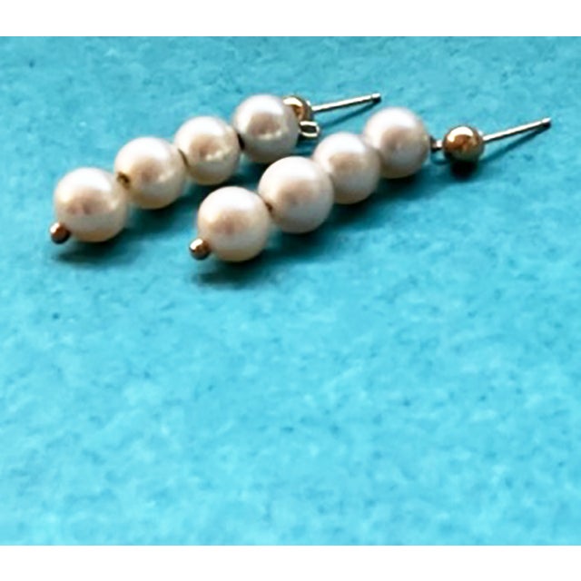 Lovely pearl and gold pierced earrings. Worn by my mother at her wedding in 1963.