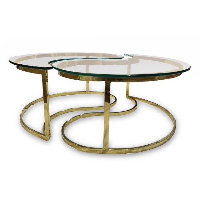 We love this beautiful tear drop brass coffee table set. The tables fit together to form a circle with a distinctive ying...