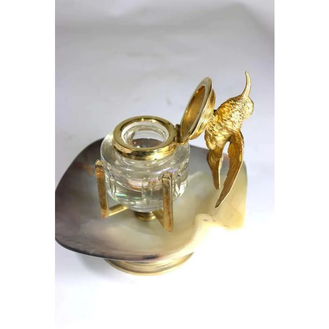 From the harkness library--an exquisite unique inkwell, a very finely detailed gold plated hummingbird as in flight, sits...