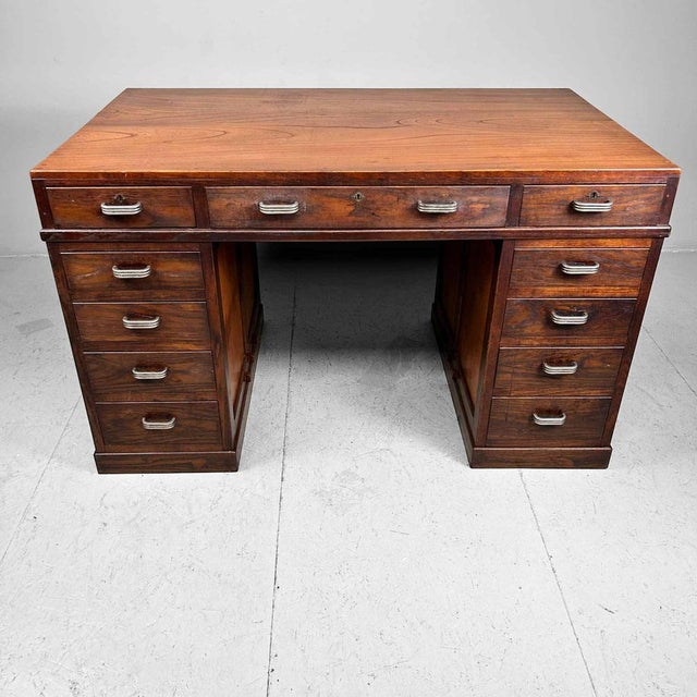 Beautiful Japanese desk from the 1930s. The wood showcases a stunning grain with a deep, warm color. This piece of...
