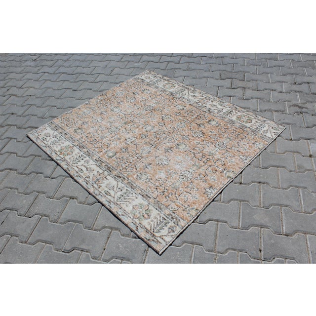 This beautiful, traditional vintage, hand knotted Turkish area rug is approximately 60 years old. It is handmade of very...