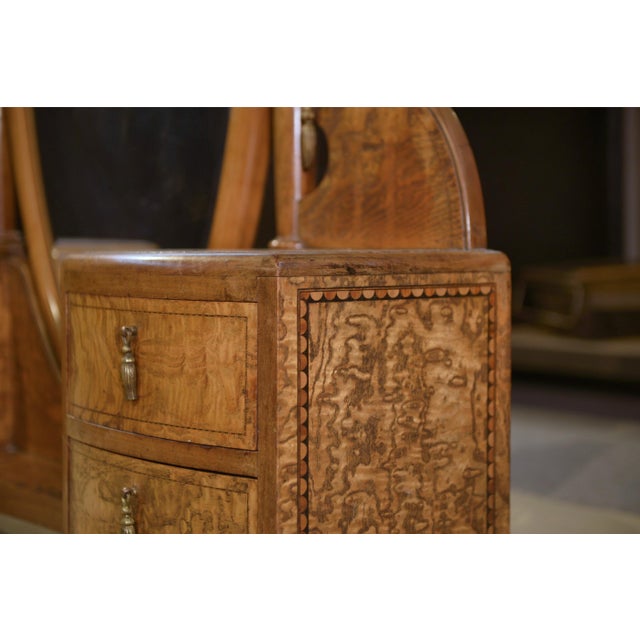 A 1930s Art Deco cheval mirror, signed Octave Dupont, from a cabinetmaker's workshop in Northern France. The piece is...