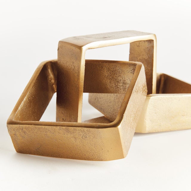 This cast aluminum objet is a modern take on the oversized chain link trend. The straight edges and square forms are a...