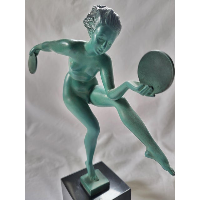 This striking French Art Deco sculpture, titled "Danse Paienne" (Pagan Dance), is a classic emblem of 1930's Parisian...
