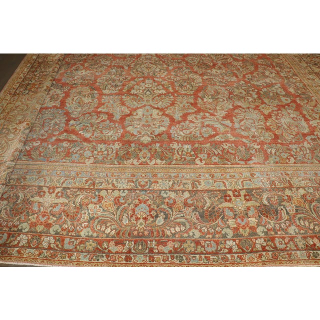 an early 20th-century Persian Sarouk Sized Adjusted Rug. 1 border is folded on 1 end during photography as it would not...