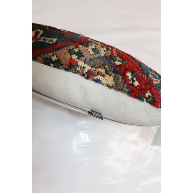 One-of-a-kind Pillow made from a 19th-century cauasian rug with cotton back. Zipper closure and foam insert provided. 17''...