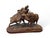 Rare and expressive 19th-century carved wooden sculpture depicting two warthogs, executed in the celebrated Black Forest...