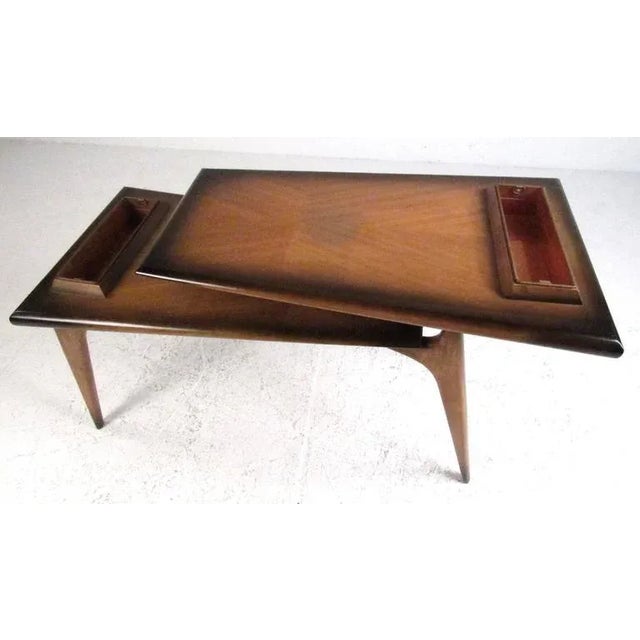 Rare Mid-Century Modern two-tier coffee table with cantilever floating top design and copper planter inserts on both...
