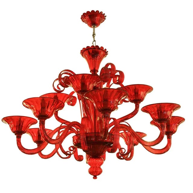 Campari red 12 lighter Venetian chandelier designed by Cenedese Made in Italy. Signed. This piece is designed in the style...